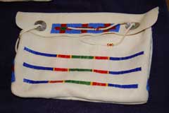Quilled Bag with blue, red, and green bead and quill pattern across front of bag and on flap of bag