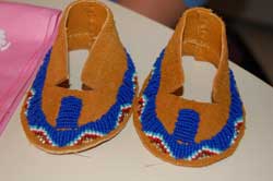 Pair of baby moccasins made by Master, Diane Combs.